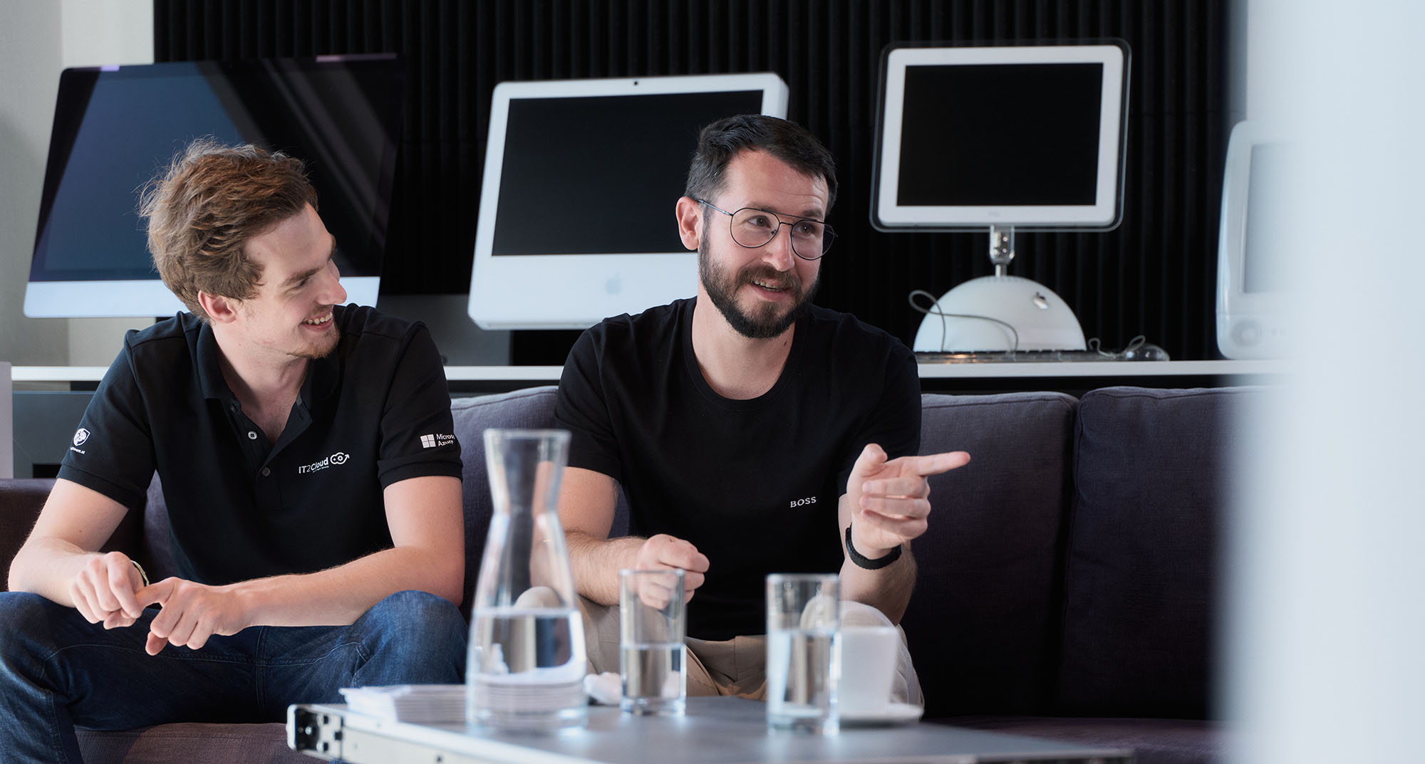 Group of IT workers having a discussion.